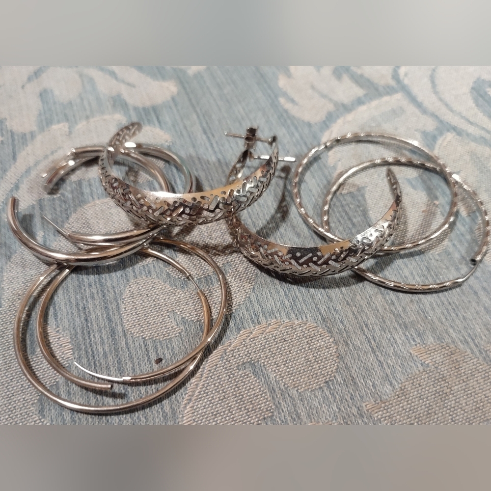 Silver tone hoop earrings (4) sets included